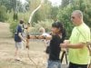 Alden-Engineer-Teaching-Archery-to-Young-Woman.jpg